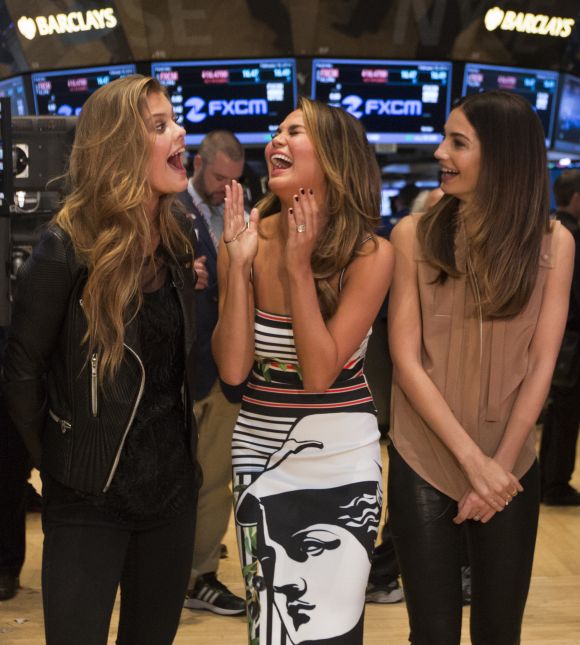 2014 Sports Illustrated Swimsuit Cover Models Nina Agdal, Chrissy Teigen and Lily Aldridge (L-R) give an interview to CNBC on the floor of the New York Stock Exchange.