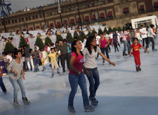Ice skaters are seen on an ice skating rink in Mexico City.