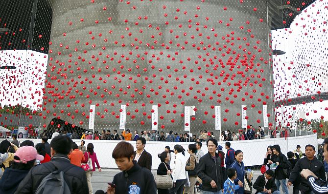 Visitors walk around the Shanghai World Expo site.