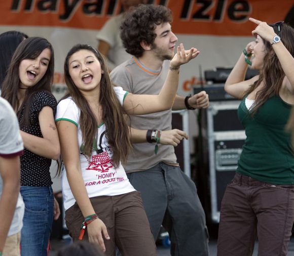 Youths dance during the Masstival music festival in Istanbul.