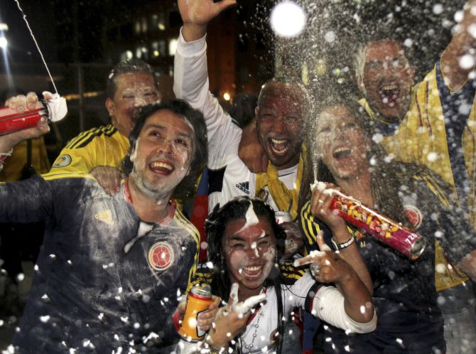Fans celebrate the qualification of Colombia's national soccer team for the 2014 World Cup tournament held in Brazil.
