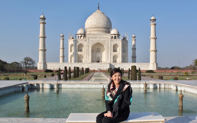 Thailand's Prime Minister Yingluck Shinawatra poses in front of the historic Taj Mahal in Agra.