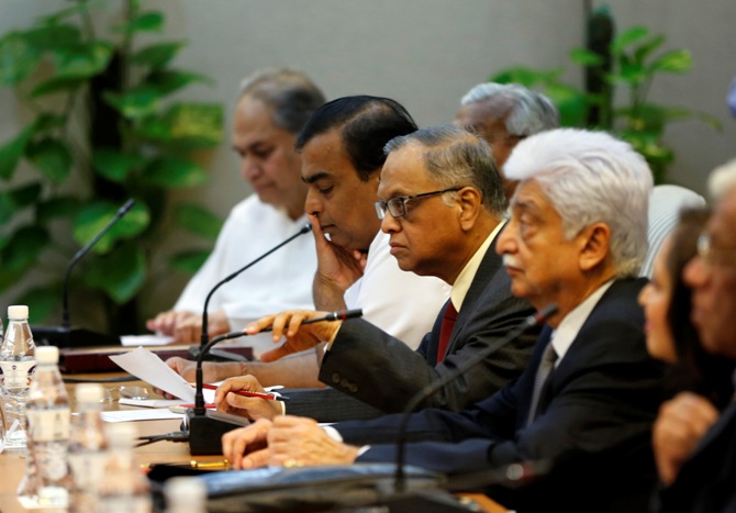 Rahul Bajaj, chairman of the Bajaj Group, Mukesh Ambani, chairman of Reliance Industries Limited, Infosys founder NR Narayana Murthy and Wipro Chairman Azim Premji (L-R) attend a meeting with India's Prime Minister Manmohan Singh (not seen) in New Delhi July 29, 2013.
