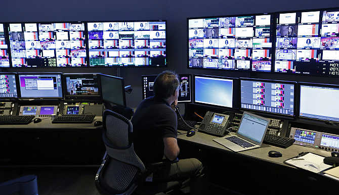 A technician works in the Acquisition Room, which receives televison feeds from around the world, during an event to mark the opening of the Univision and Fusion television networks newsroom in Doral, Florida, United States.