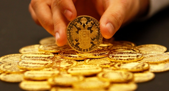 An employee sorts cold coins in the Austrian auction house Dorotheum in Vienna.