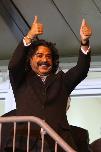 Shahid Khan celebrating Fulham's victory in the Barclays Premier League.