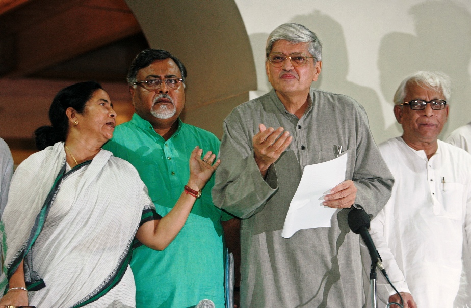 This file photo shows former West Bengal Governor Gopal Krishna Gandhi (2nd right) addressing a press conference as state's former Chief Minister Buddhadeb Bhattacharya (right), Trinamool Congress party chief and Chief Minister Mamata Banerjee (left) and Partha Chatterjee, former West Bengal Industry Minister, watch in Kolkata on September 7, 2008.