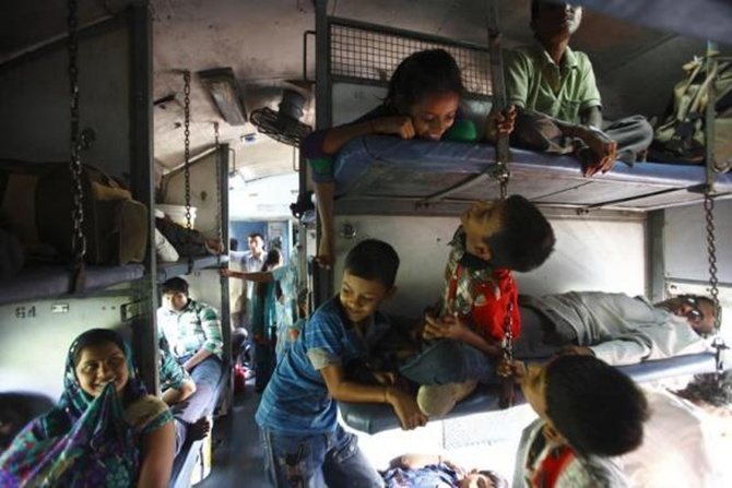 Children travel on a train heading from Agra to Kanpur in Uttar Pradesh.