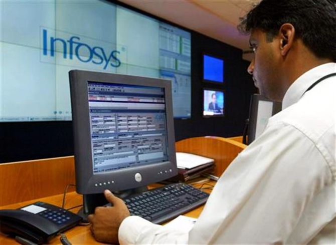 Staff working at Infosys headquarters in Bangalore.