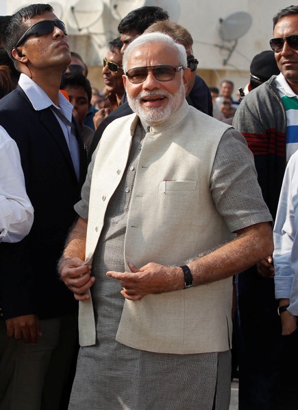 Narendra Modi, prime ministerial candidate for Bharatiya Janata Party and Gujarat's chief minister, smiles during a kite flying festival in Ahmedabad January 14, 2014.