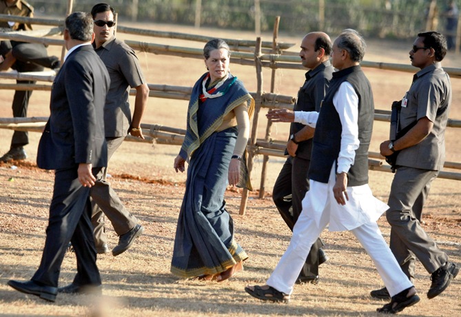 Chief of Congress party Sonia Gandhi walks to greet her supporters after she addressed a rally.
