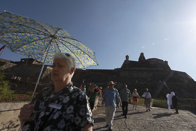Tourists visit at the Castillo San Felipe in Cartagena, December 16, 2012. Cartagena's peak season for tourism starts on December 15 and goes on into the second week of February.