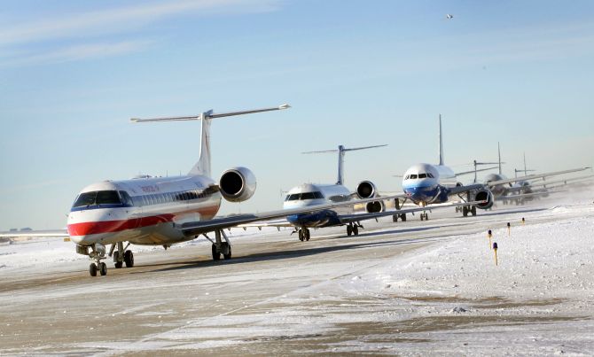 Planes wait in line to take off from O'Hare International Airport.