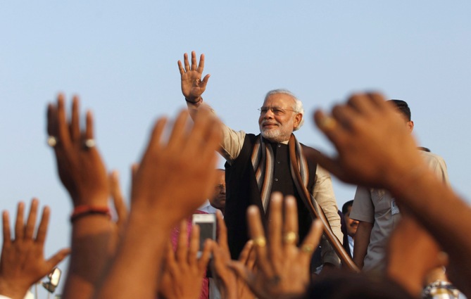 Narendra Modi, prime ministerial candidate for Bharatiya Janata Party and Gujarat's chief minister, waves towards his supporters. 
