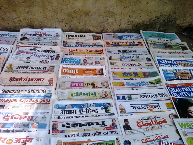 Indian Newspapers for sale at a vendors shop in New Delhi.