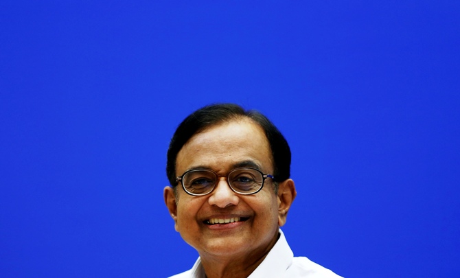 India's Finance Minister Palaniappan Chidambaram smiles during a news conference in New Delhi.
