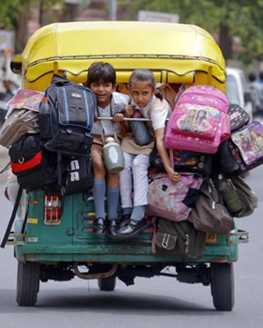 School children pack a auto-rickshaw on their way to school in Ahmedabad.