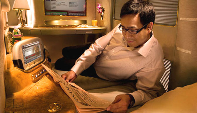 A passenger enjoying the comfort of Emirates A380 cabin.