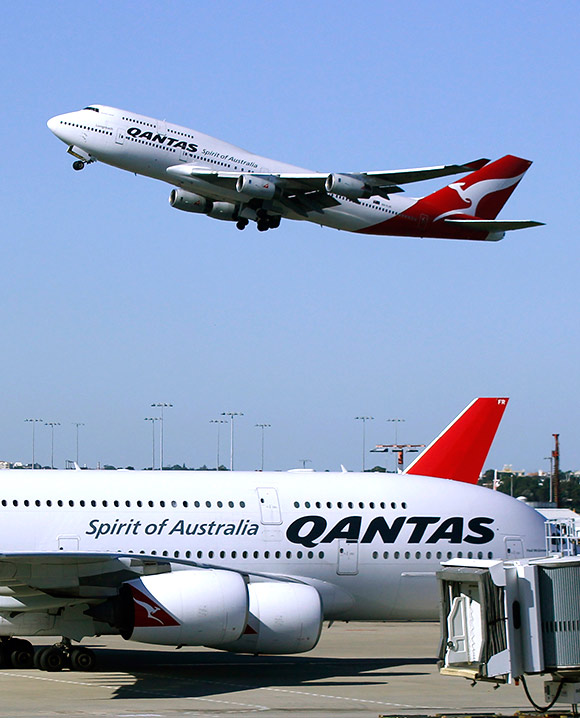 A Qantas 747 flies past a Qantas A380 as it takes off from Kingsford Smith international airport in Sydney.