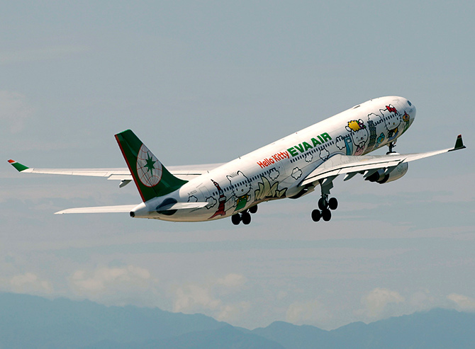 An Airbus A330-300 aircraft of Taiwan's Eva Airlines, decorated with Hello Kitty motifs, takes off from Taoyuan International Airport, northern Taiwan to Sapporo, Japan.