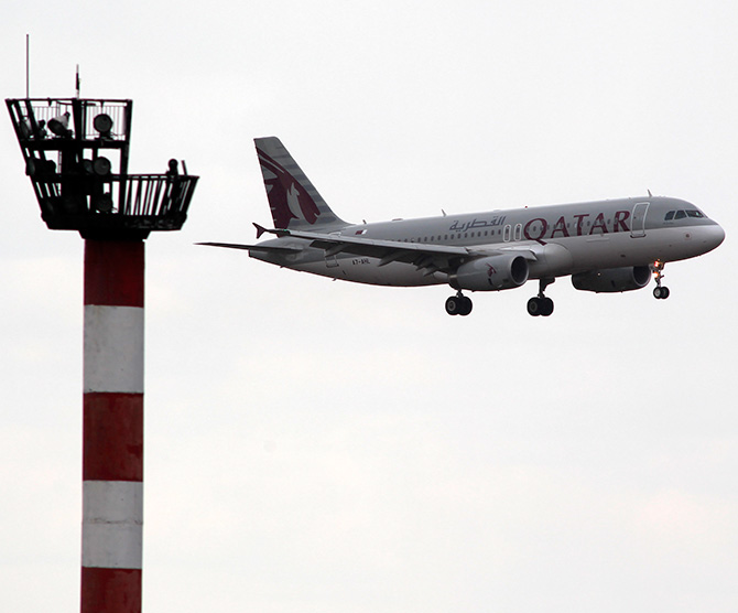 A Qatar Airwais Airbus A320 plane prepares to land at Henri Coanda Airport in Otopeni, near Bucharest.