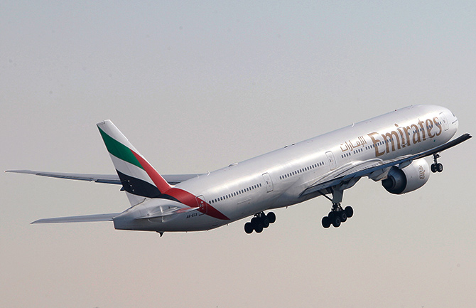 An Emirates Airlines Boeing 777-300 aircraft takes off during the Dubai Airshow.