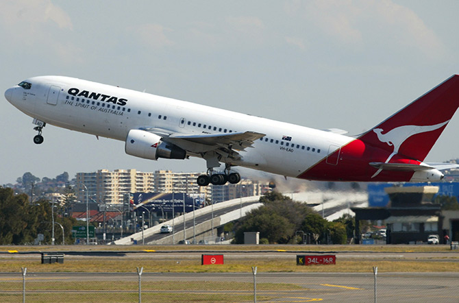 A Qantas passenger jet takes off from Sydney Airport.