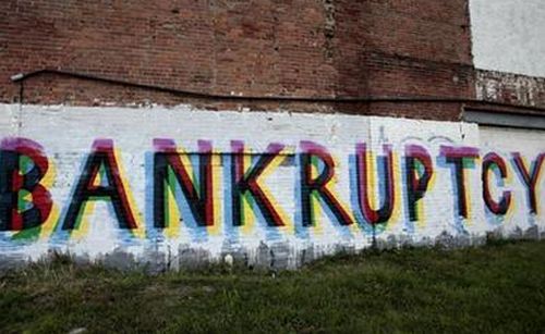 The word 'Bankruptcy' is seen painted on the side of a vacant building by street artists as a statement on the financial affairs of the city on Grand River Avenue in Detroit, Michigan July 26, 2013.