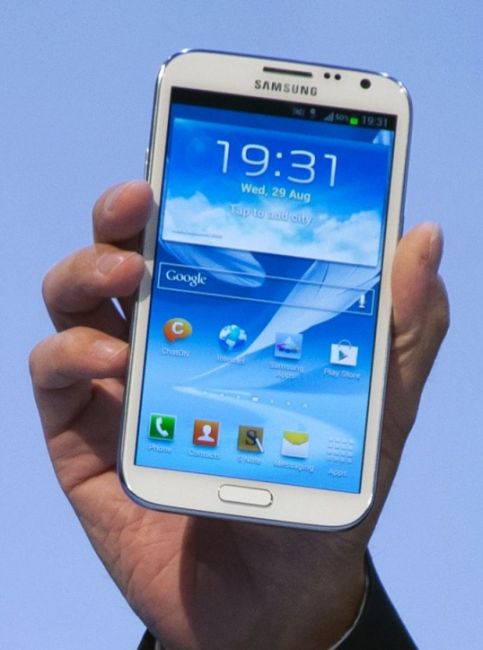 A man presents the new Samsung Galaxy device.