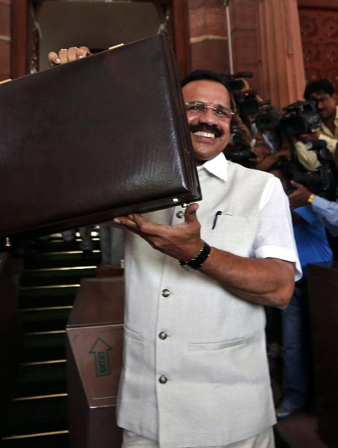 India's Railway Minister Sadananda Gowda arrives to present the railway budget for the 2014/15 fiscal year.