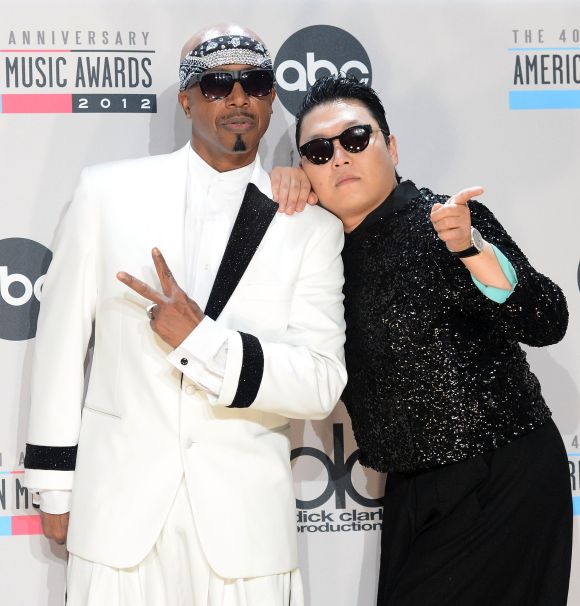 Musicians MC Hammer and Psy.