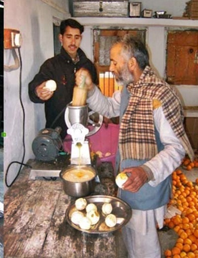 A family uses electricity for making juice for sale.