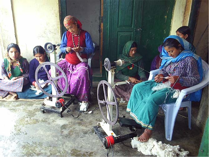 In village Genwali,  women use carded wool to spin yarn using their own hydropower.