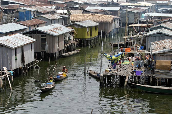 Women sell food from their canoe at Makoko fishing community in Lagos.