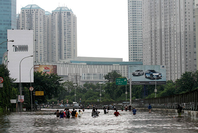 Flood waters inundate the main street in west Jakarta.