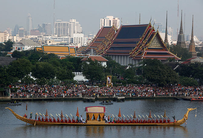 Thai oarsmen row a royal barge during a dress rehearsal for Royal Barge Procession, on the Chao Phraya River in Bangkok.