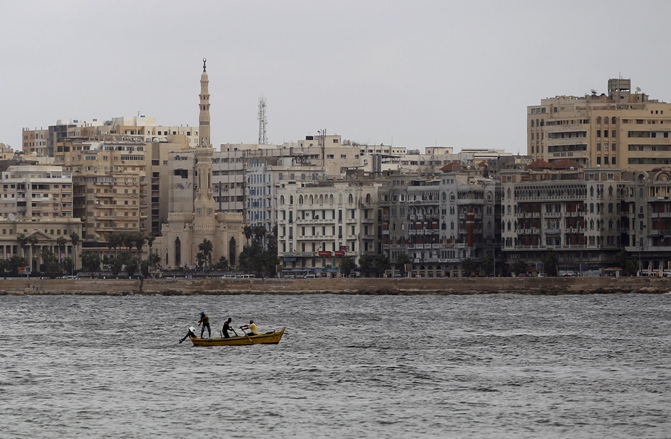 Men fish during the last day of Eid al-Adha in the Mediterranean city of Alexandria, 230 km (143 miles) north of Cairo.