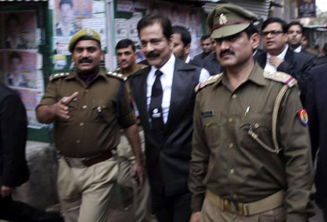 File photo of Subrata Roy being escorted by police to a court in Lucknow on February 28, 2014.