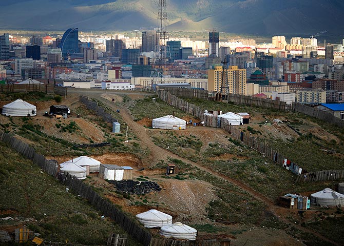 Gers, traditional Mongolian tents, are seen on a hill in an area known as a ger district in Ulan Bator.
