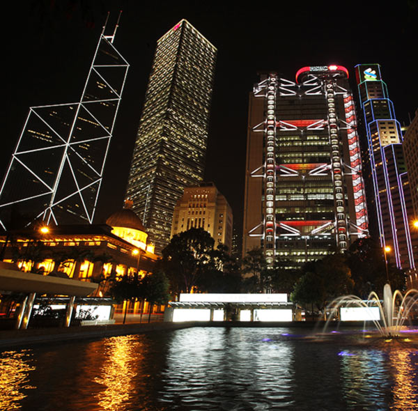 Hong Kong's central financial district's (L-R) Bank of China Tower, Cheung Kong Centre, HSBC headquarters, Standard Chartered Bank and Legislative Council (front L) are pictured lighted up.