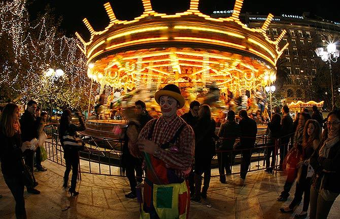 A clown entertains people at central Syntagma square in Athens.