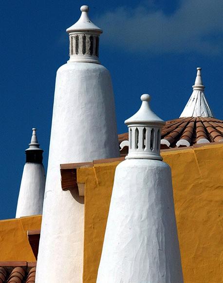 Traditional chimnies of rural houses in the Portuguese Southern province of Algarve.