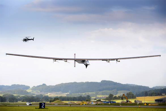  solar-powered Solar Impulse 2 experimental aircraft lands during its maiden flight in Payerne.