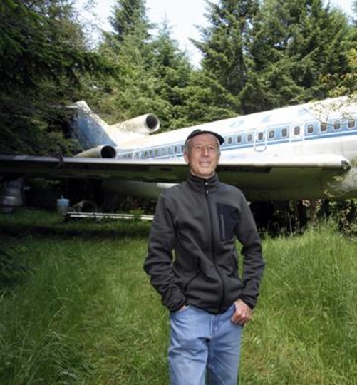 Bruce Campbell stands near his Boeing 727 home.