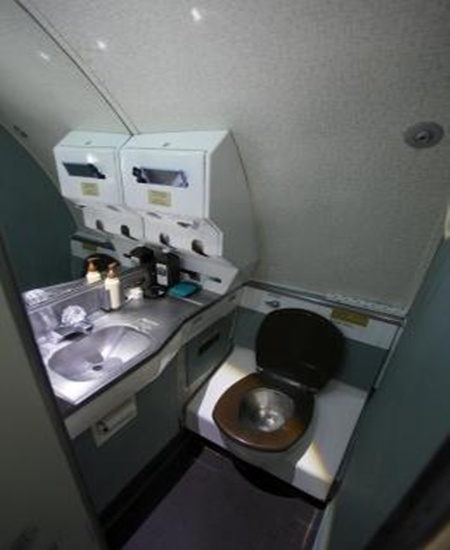 A fully functional lavatory is seen in the Boeing 727 home of Bruce Campbell, in the woods outside the suburbs of Portland.