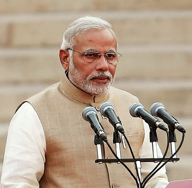 Prime Minister Narendra Modi takes his oath at the Rashtrapati Bhavan in New Delhi.