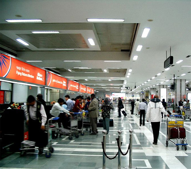 Passengers at the Delhi Airport.
