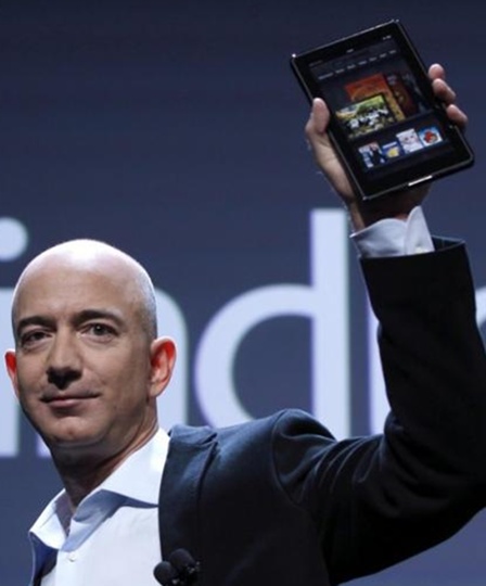 Amazon CEO Jeff Bezos holds up the new Kindle Fire.