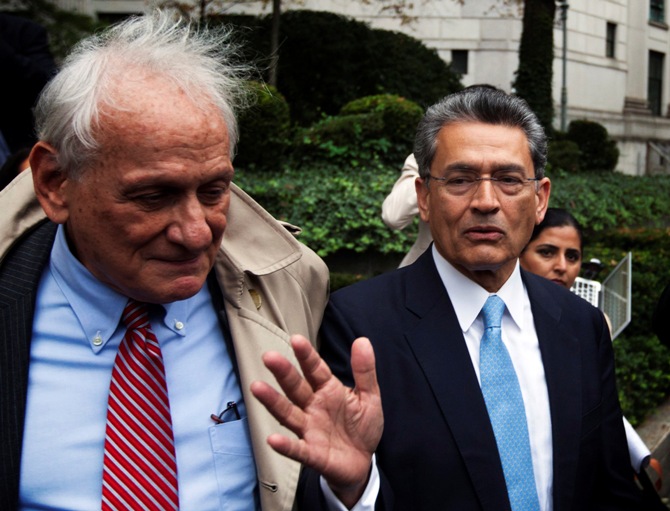 Former Goldman Sachs Group Inc board member Rajat Gupta (R) departs Manhattan Federal Court with his lawyer, Gary Naftalis (L) after being sentenced in New York, October 24, 2012.