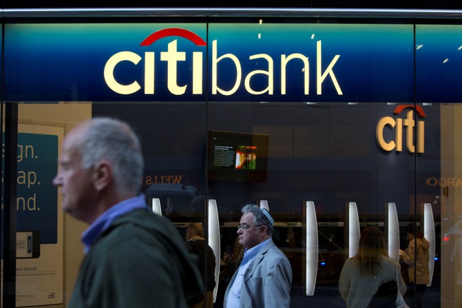 People walk past a Citibank branch in New York.